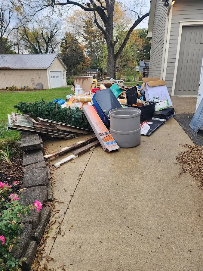 Dumpster being loaded with debris for 3 Yard Dumpster Rental in Geneseo